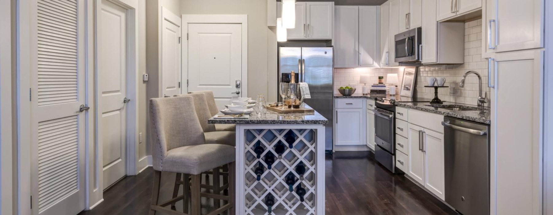 a kitchen with white cabinets