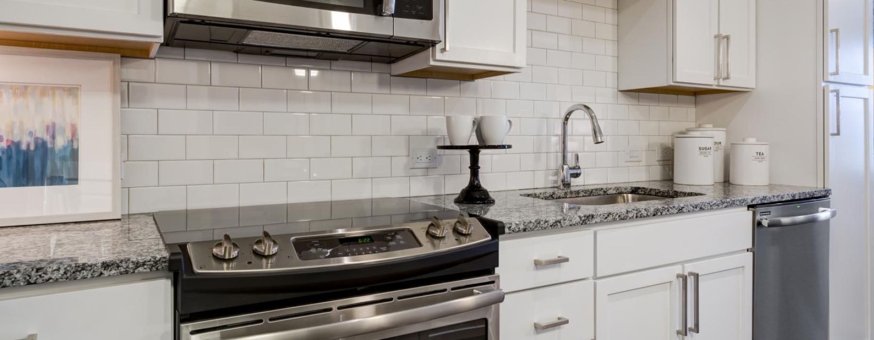 a kitchen with white cabinets