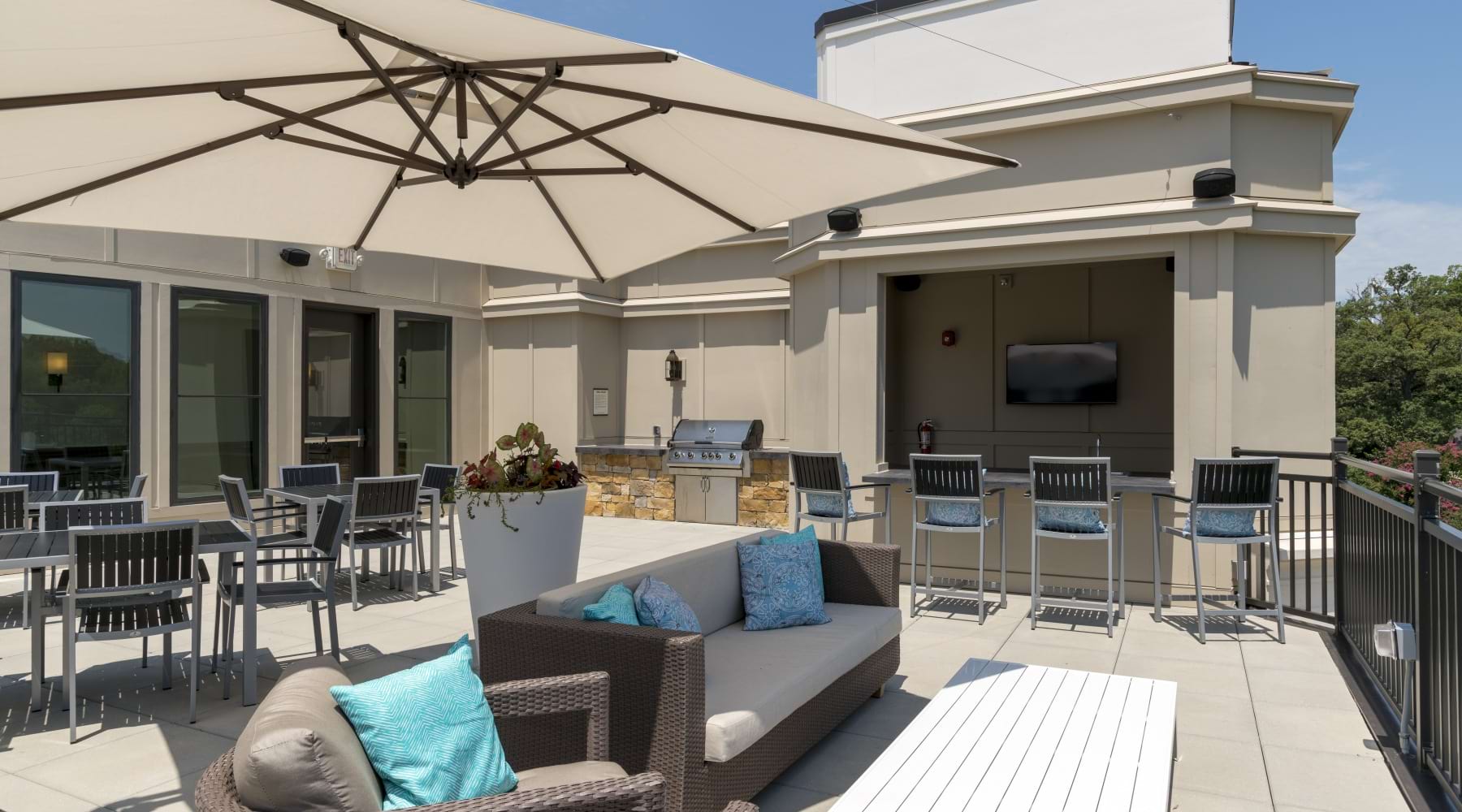 Rooftop lounge with outdoor seating and city views