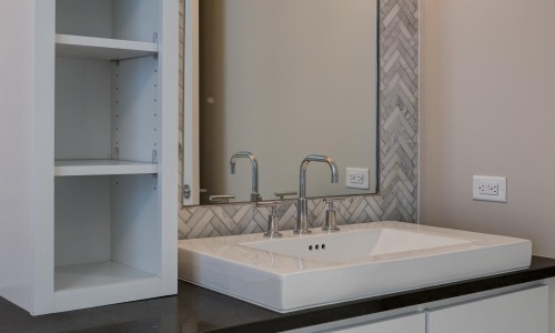 a bathroom with a mirror and sink