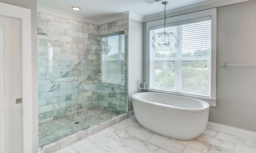 a bathroom with a tub and shower